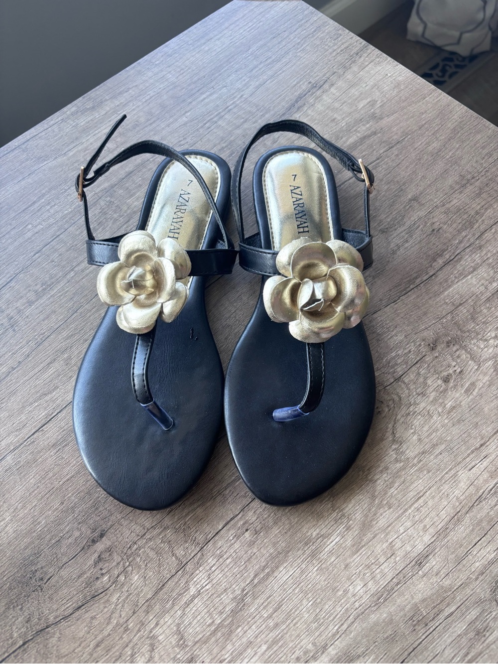 Azarayah Black Sandals with Gold Flower Accent